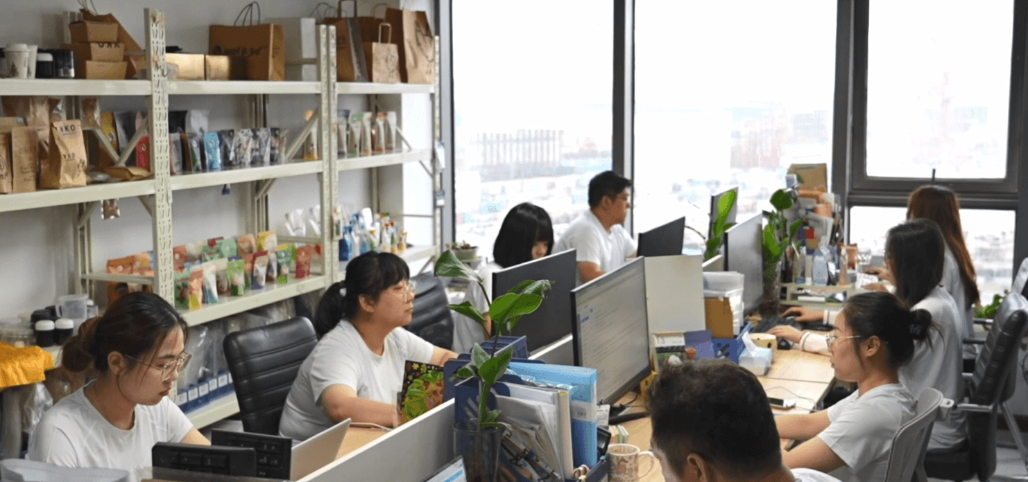 Mylarbag office team working on packaging project coordination